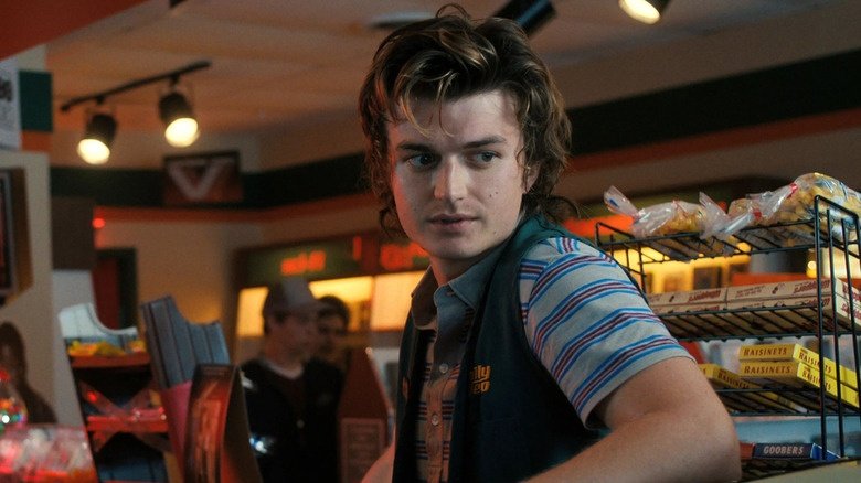 Joe Keery as Steve Harrington, looking concerned with his signature hairstyle.