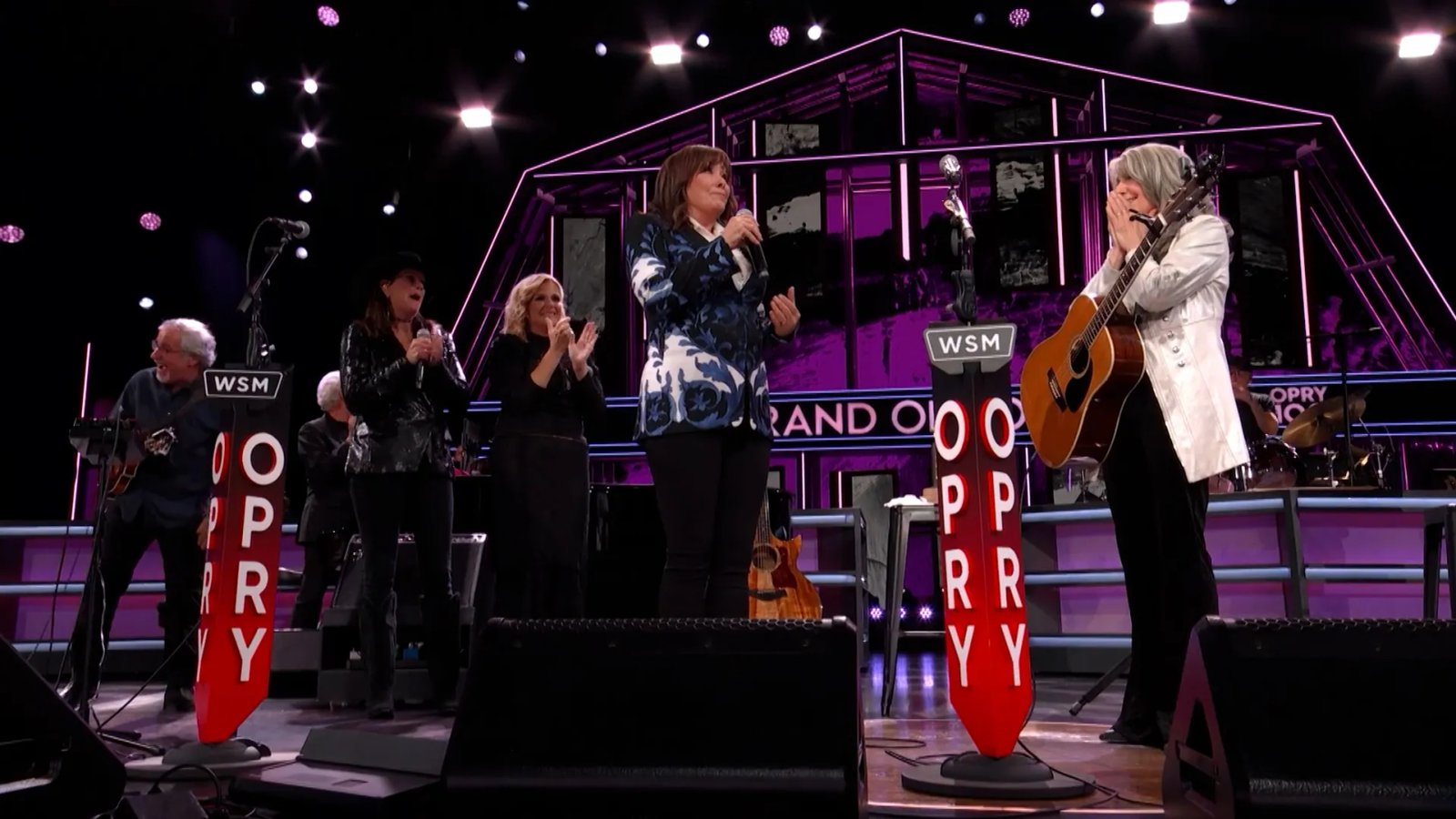 A close-up of the Grand Ole Opry stage during a performance.