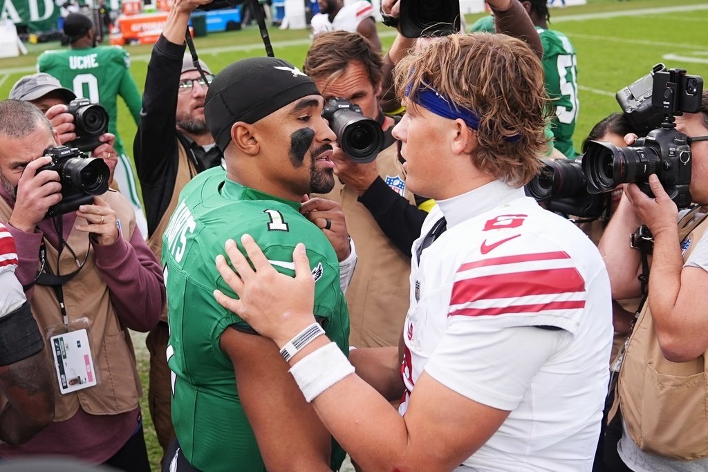 Jaxson Dart in action, showcasing his determination to win