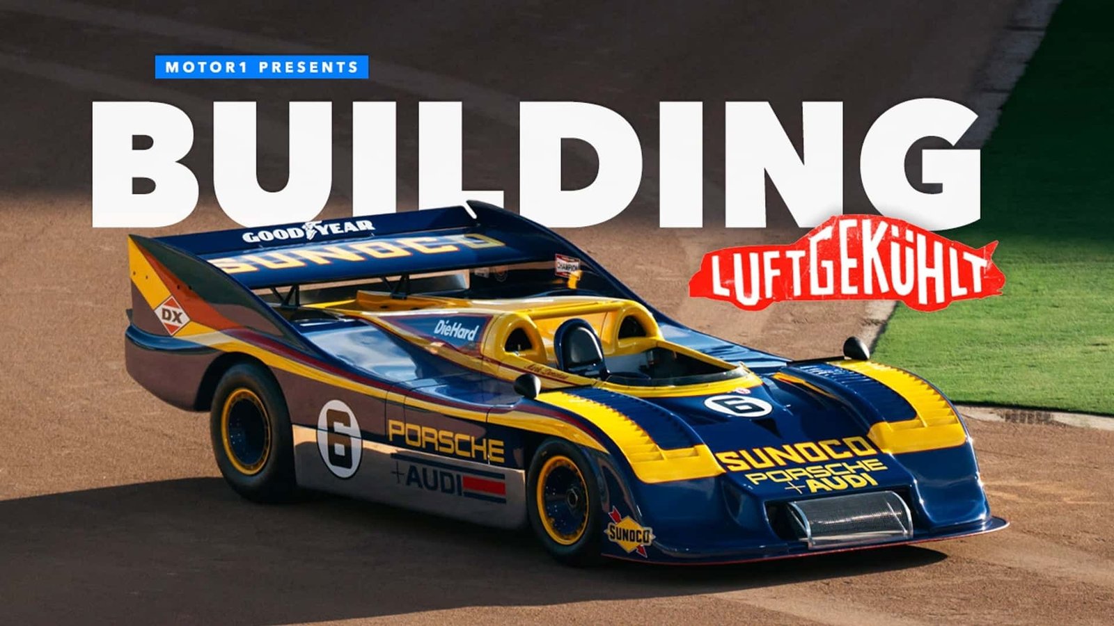 A fleet of vibrant Porsche cars lined up at a prestigious event track, reflecting a clear blue sky.