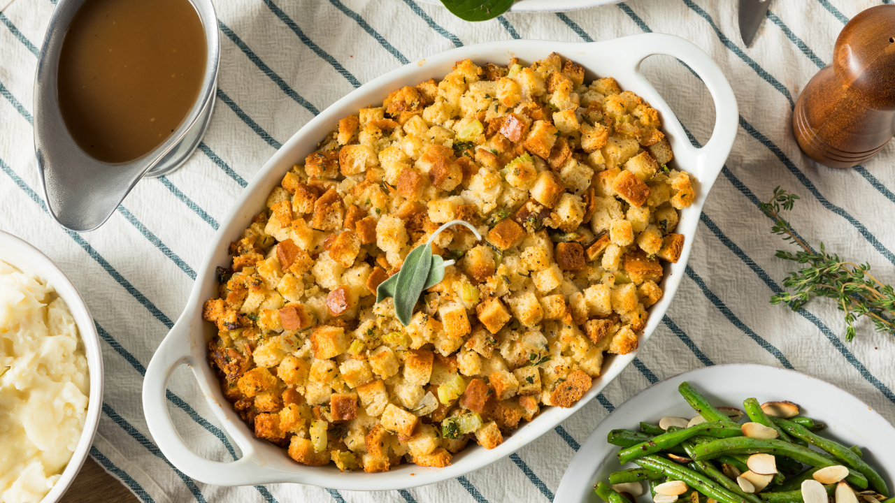 A golden brown and delicious Thanksgiving stuffing, baked in a casserole dish.