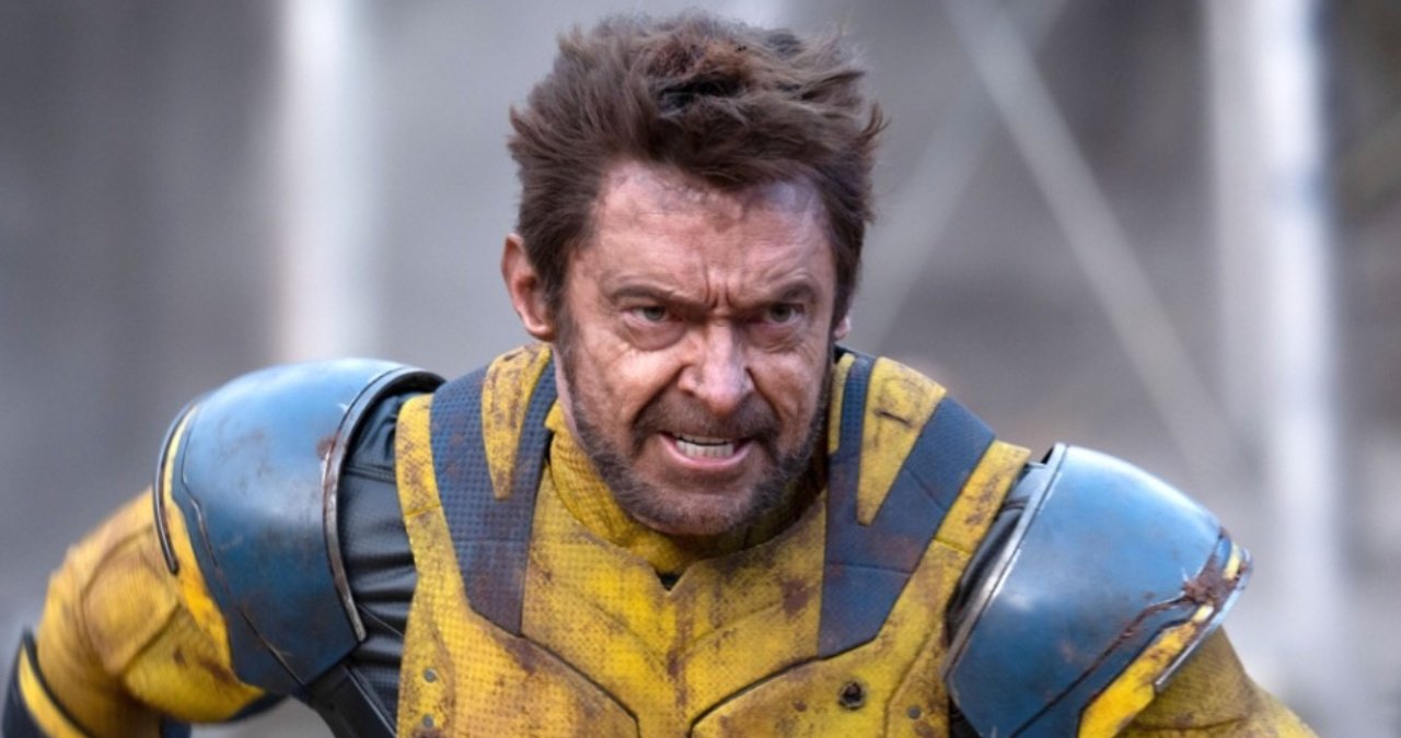 Hugh Jackman as Wolverine, claws extended, looking battle-worn.