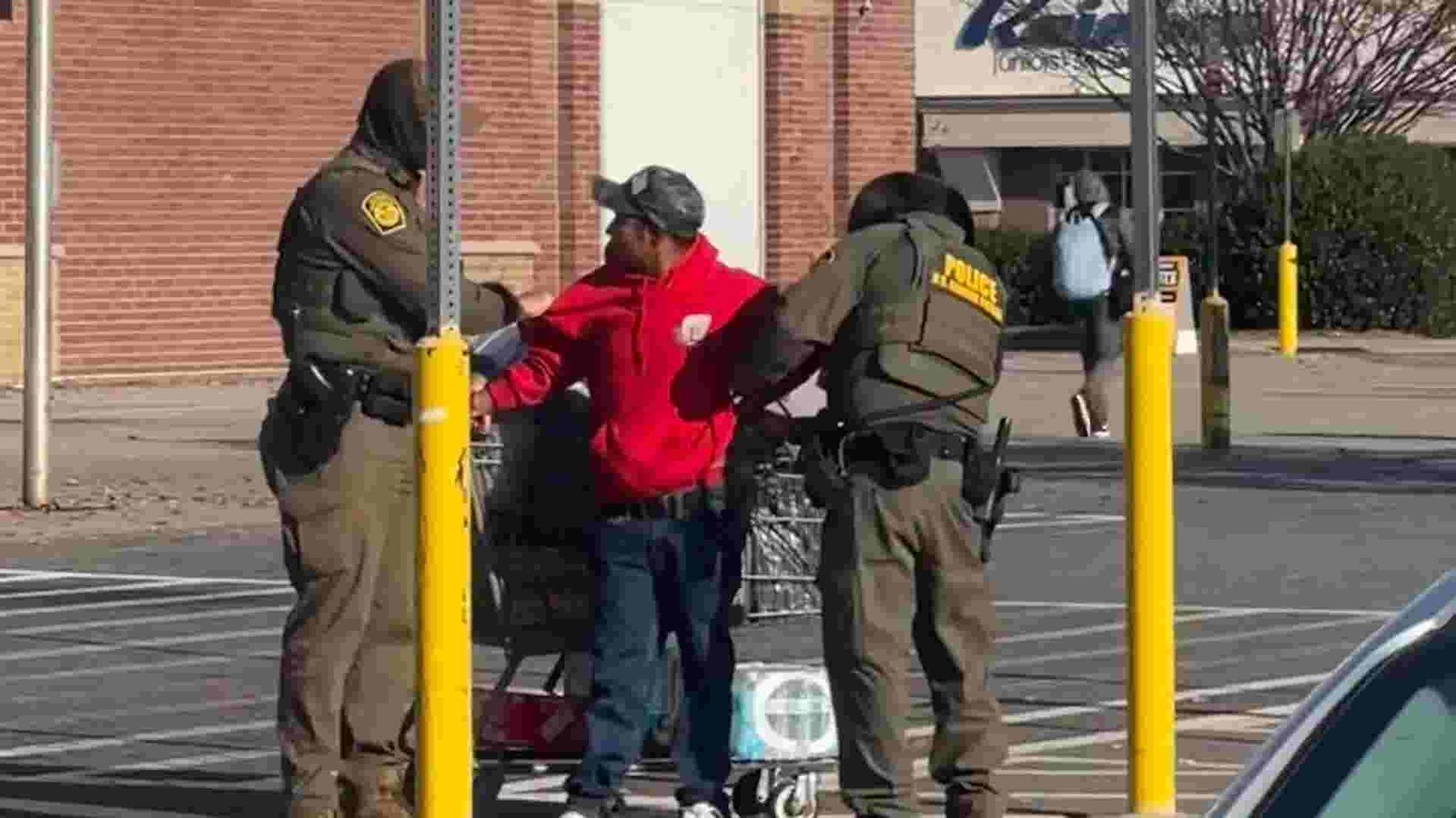 A somber family looking at news headlines about immigration crackdowns in Charlotte