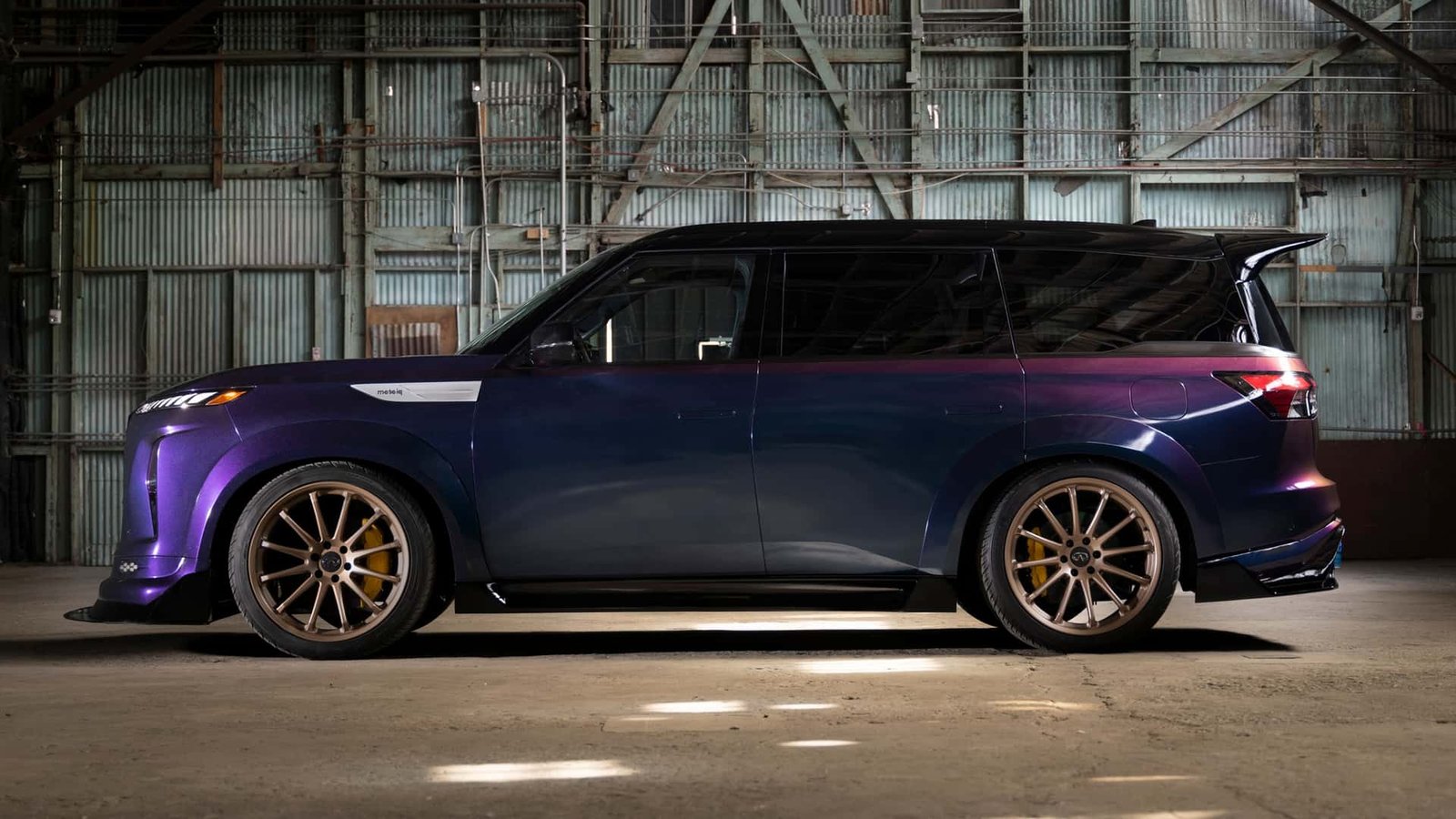 Infiniti QX80 with the 1,000-horsepower GT-R VR38DETT engine visibly installed, showcasing custom modifications.