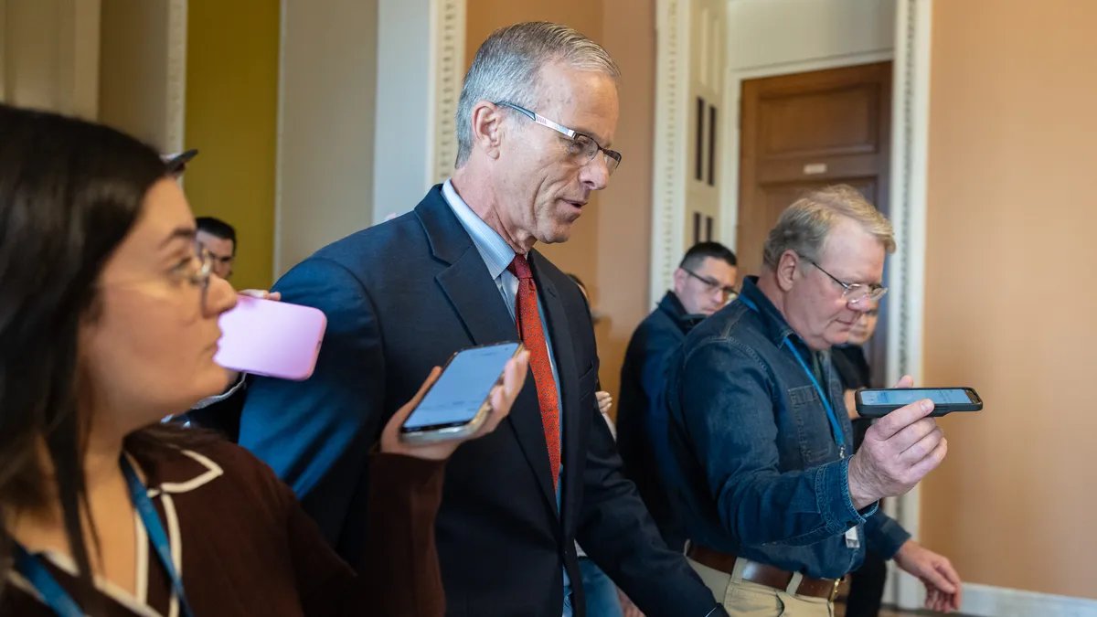 The US Capitol Building illuminated at dusk. 