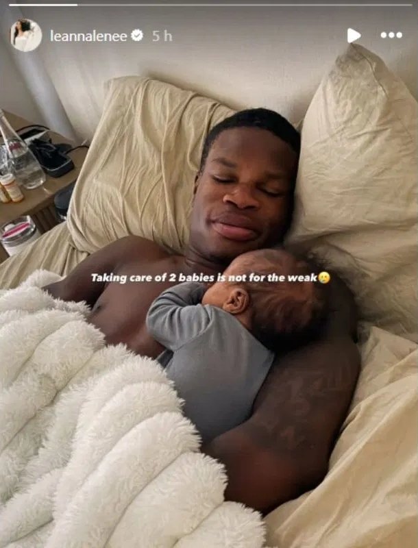 A candid shot of Travis Hunter looking surprised and slightly overwhelmed, possibly after encountering the chores.