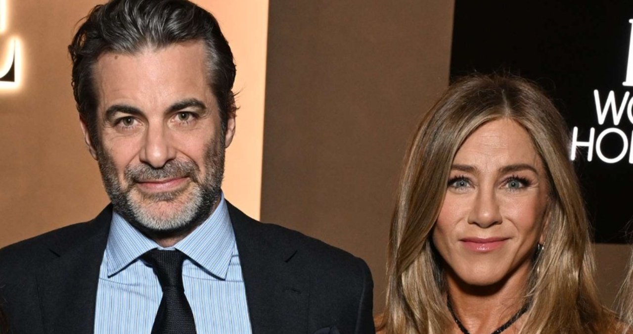 Jennifer Aniston and Jim Curtis on a red carpet, showcasing their combined star power.