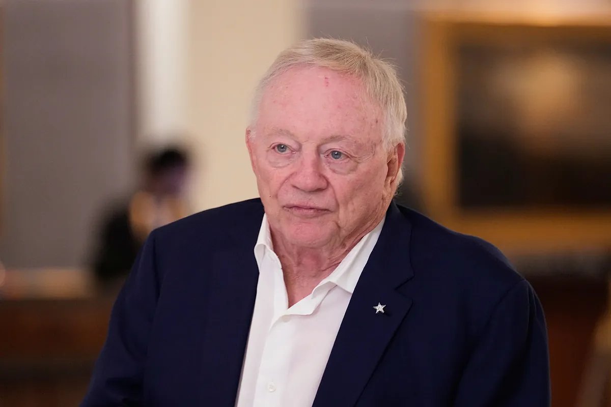Jerry Jones shown making a public statement, looking resolute and empathetic.
