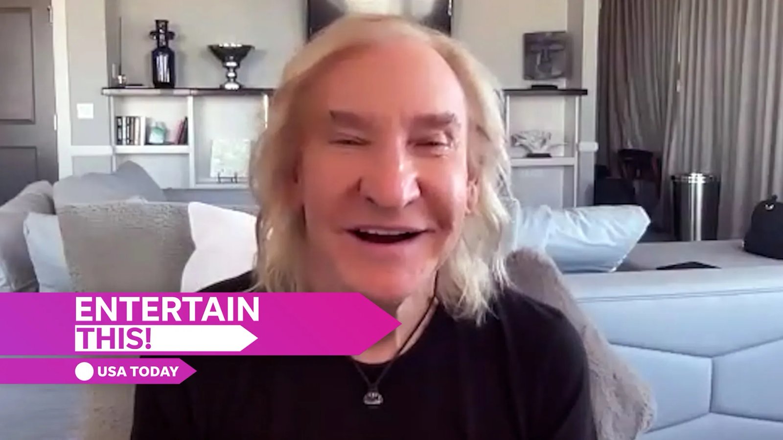 Vince Gill on stage with his guitar, delivering a heartfelt performance.