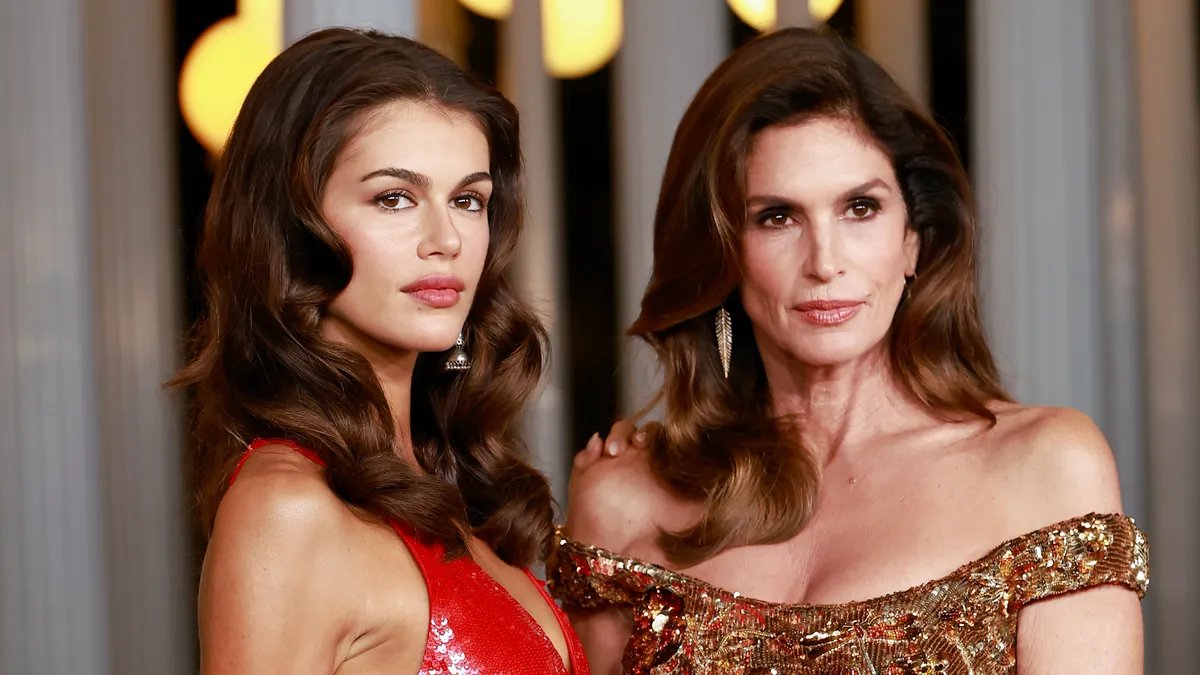 Kaia Gerber posing on the red carpet, looking sophisticated yet slightly detached.