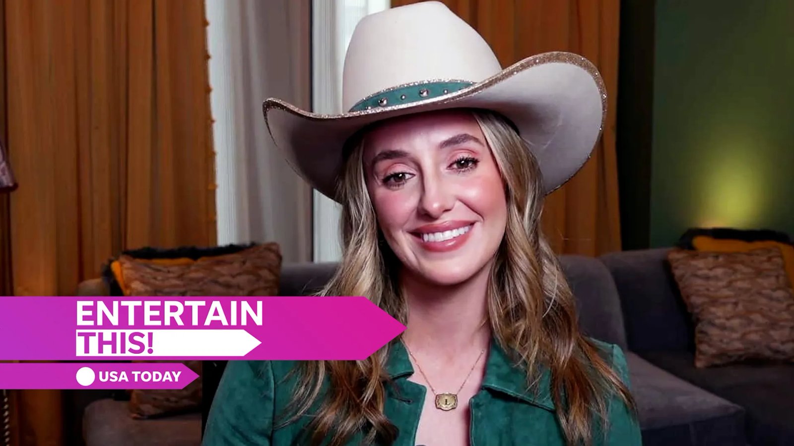 Close-up of Lainey Wilson's smiling face, highlighting her bright eyes and joyful expression.