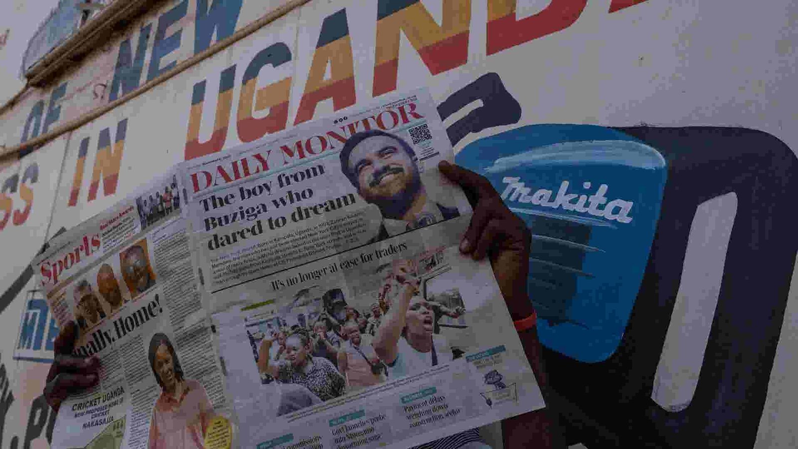 Mamdani addressing a jubilant crowd of young Ugandans, symbolizing hope and inspiration