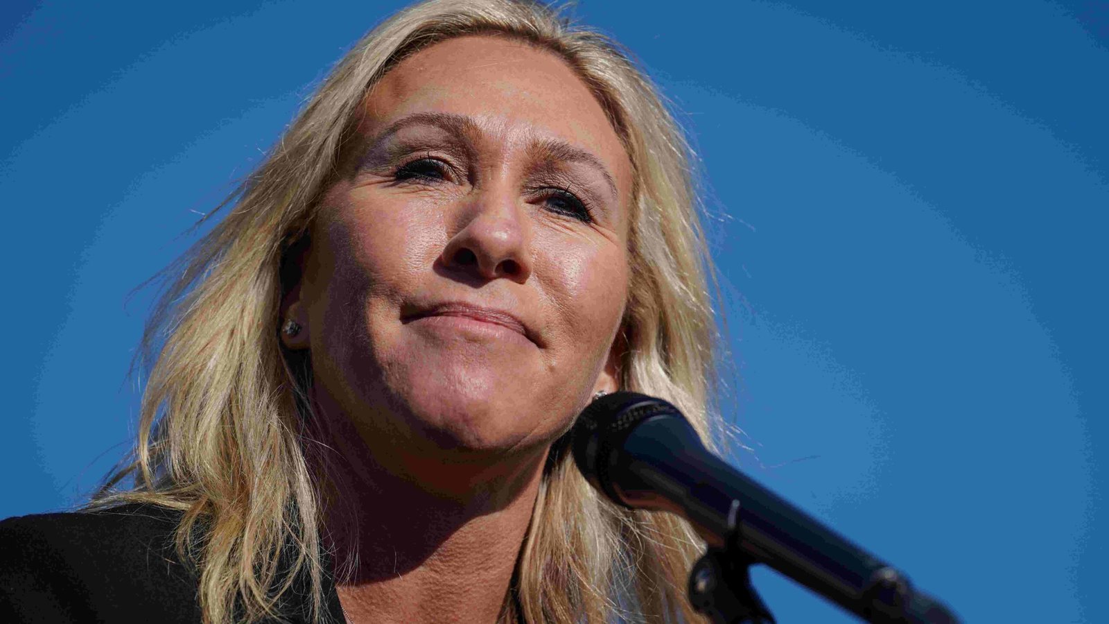 Marjorie Taylor Greene speaking at a rally.