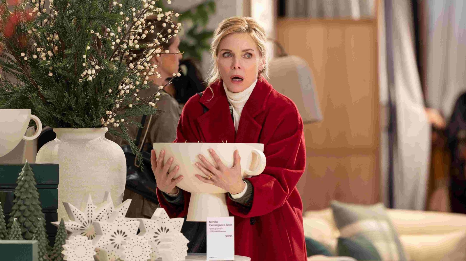 Michelle Pfeiffer looking surprised and slightly mischievous in a scene from 'Oh. What. Fun.'