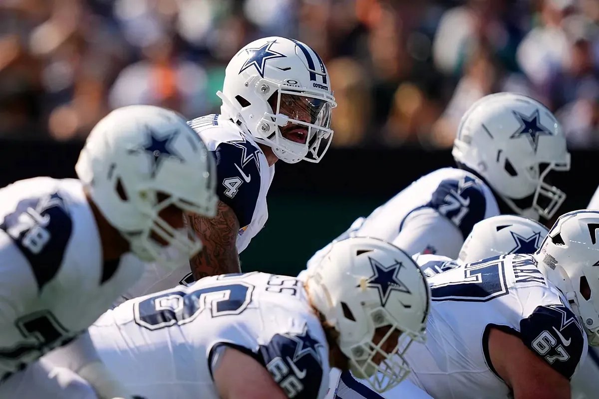 A packed stadium with fans cheering during an NFL game, highlighting the excitement of Week 12.