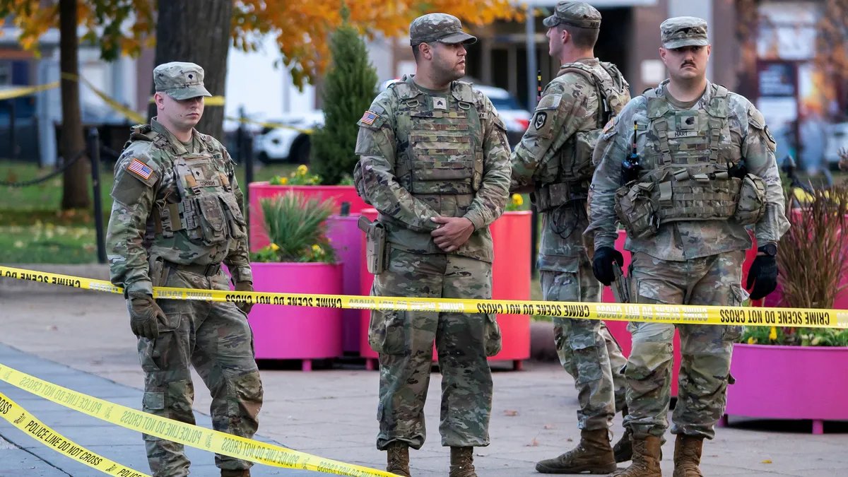 National Guard members stand at attention during a training exercise.