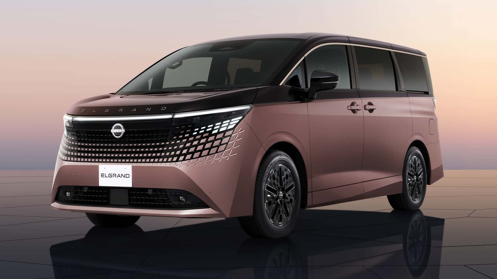 The sleek, modern exterior of the newly redesigned Nissan minivan, showcasing its refreshed grille and LED lighting.