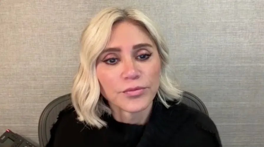 A healthy plate filled with lean protein, colorful vegetables, and a small portion of a holiday treat.