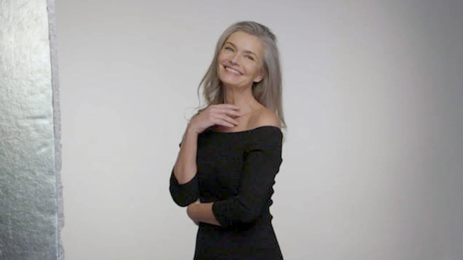 Paulina Porizkova smiling and looking confident.