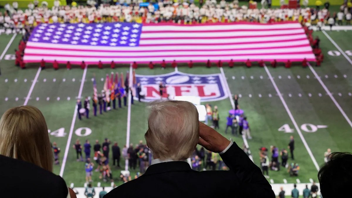 Donald Trump attending a football game