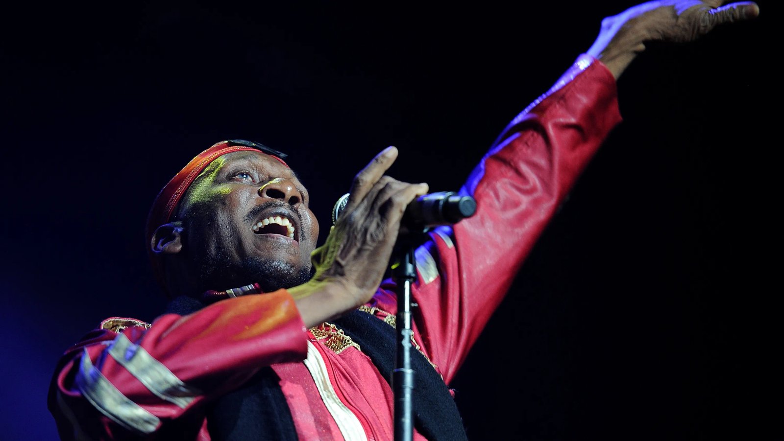 Jah Light accepting an award for his contributions to reggae music.