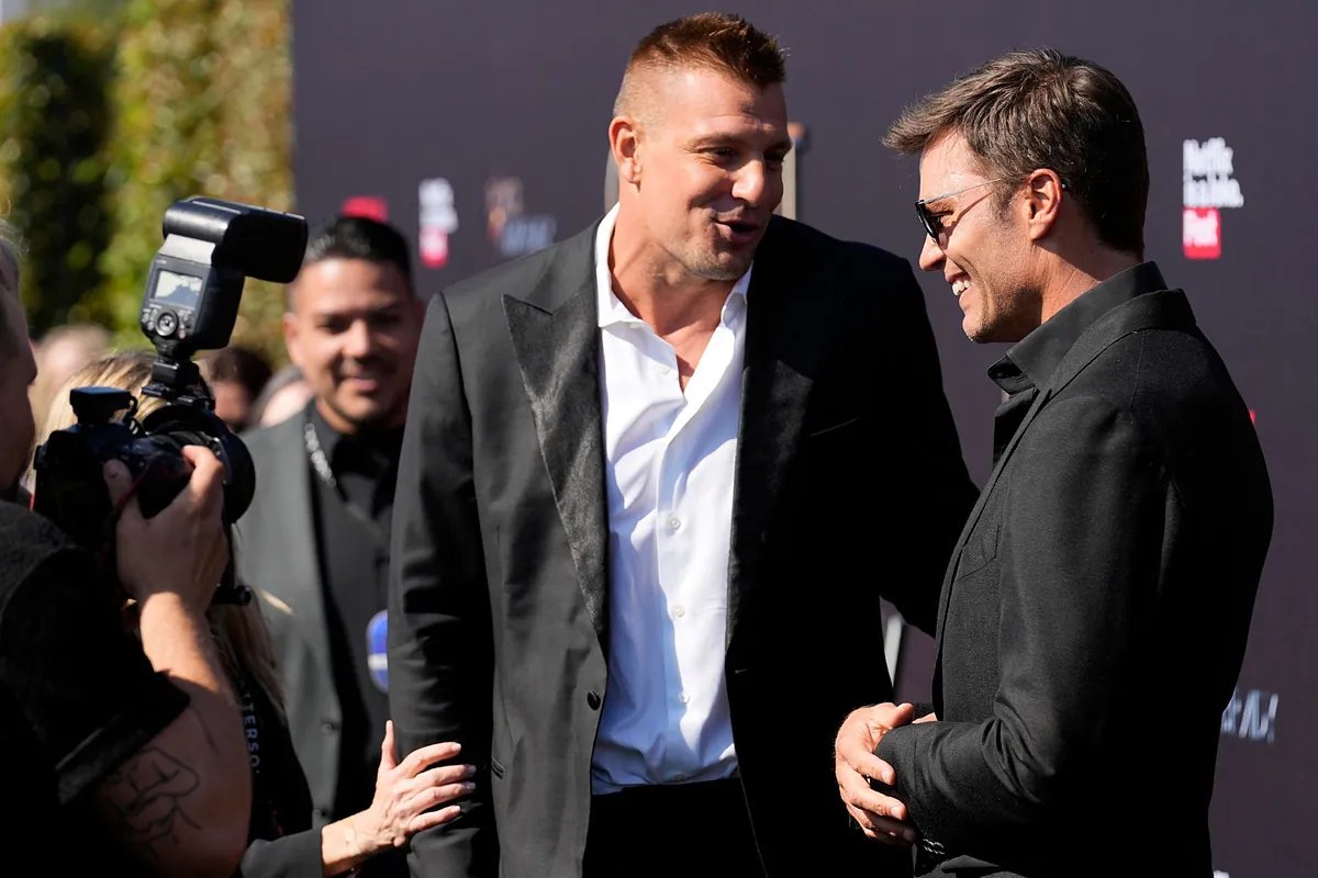 Rob Gronkowski and Tom Brady celebrating a Super Bowl victory with the New England Patriots.