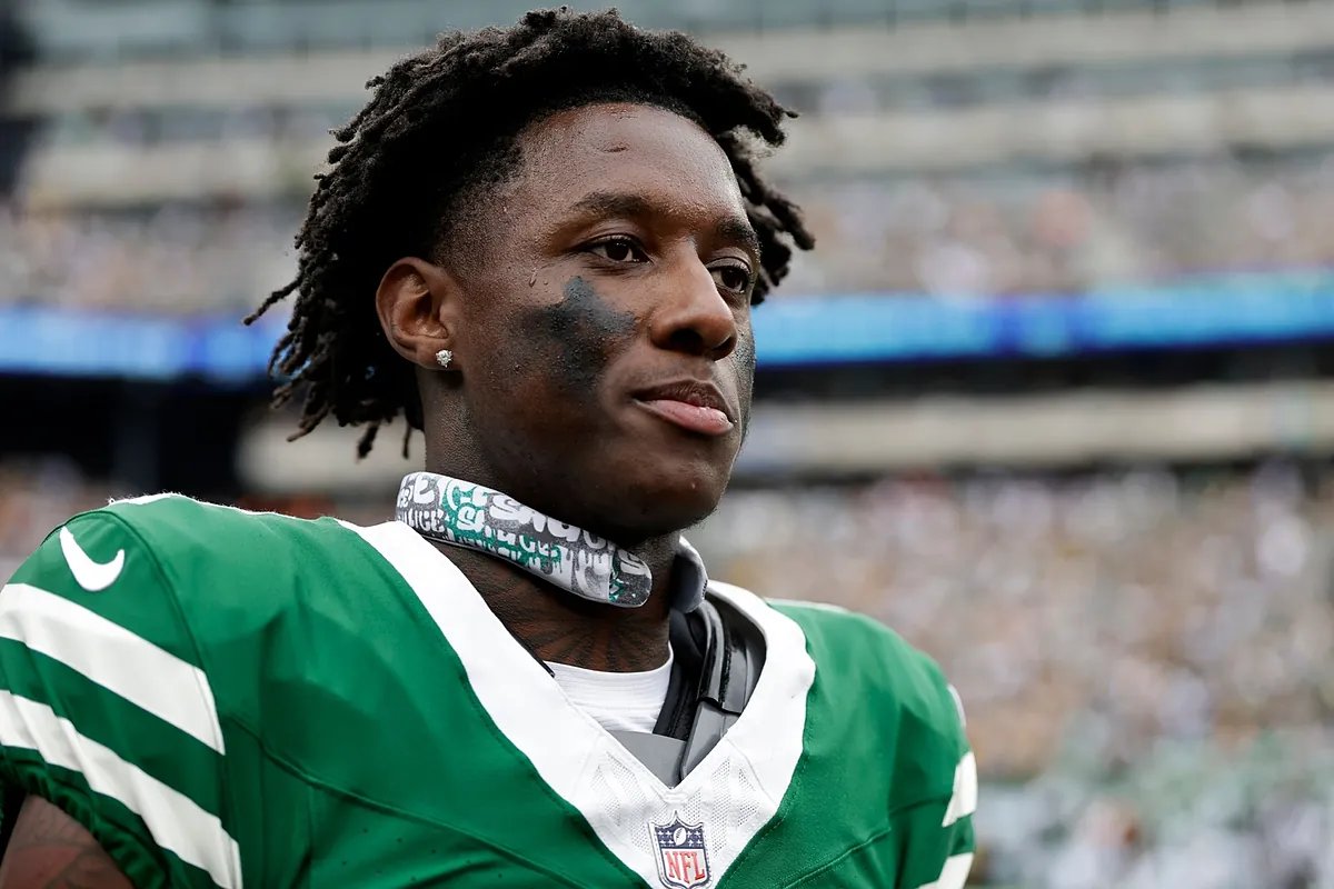 Sauce Gardner in a New York Jets uniform, looking determined, representing the unexpected Sauce Gardner trade.