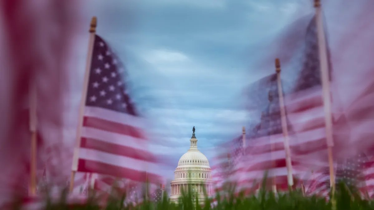 A view of the U.S. Capitol Building under a clear sky, symbolizing legislative progress after a crucial vote.