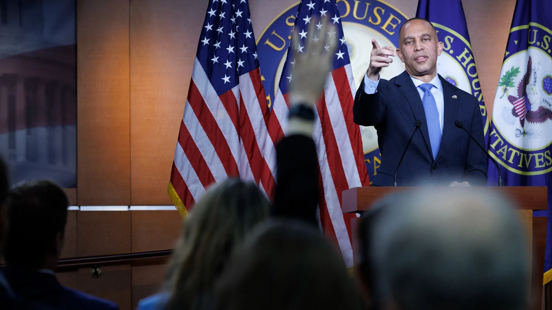 A gavel rests on a stack of law books, symbolizing legal challenges and judicial processes.