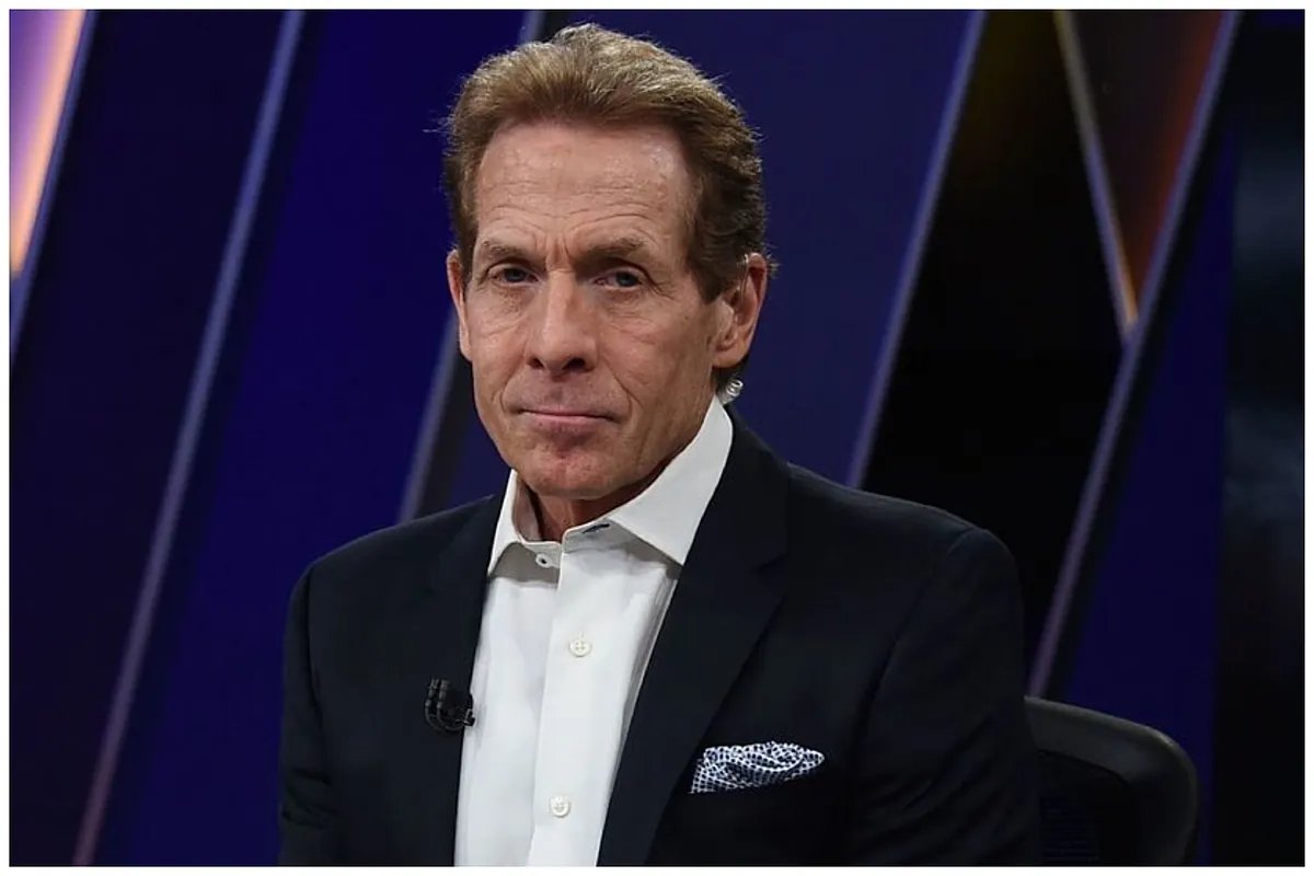 Skip Bayless passionately discussing the Dallas Cowboys' playoff chances on a sports talk show.