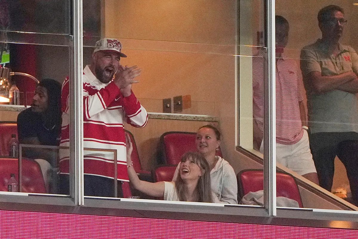 Taylor Swift and Travis Kelce enjoying a quiet moment together, illustrating their focus on intimacy despite fame.