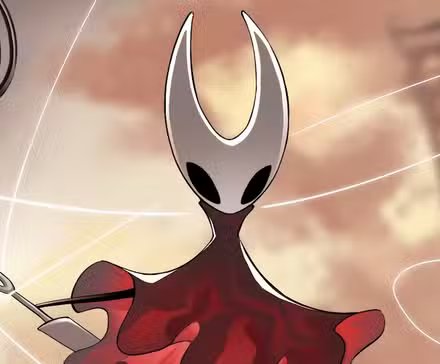 A fan cosplaying as the Knight from Hollow Knight at a gaming convention.