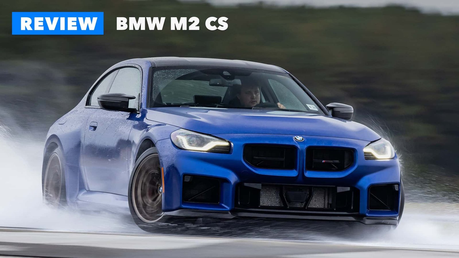 The 2026 BMW M2 CS showcasing its drifting prowess on a racetrack.