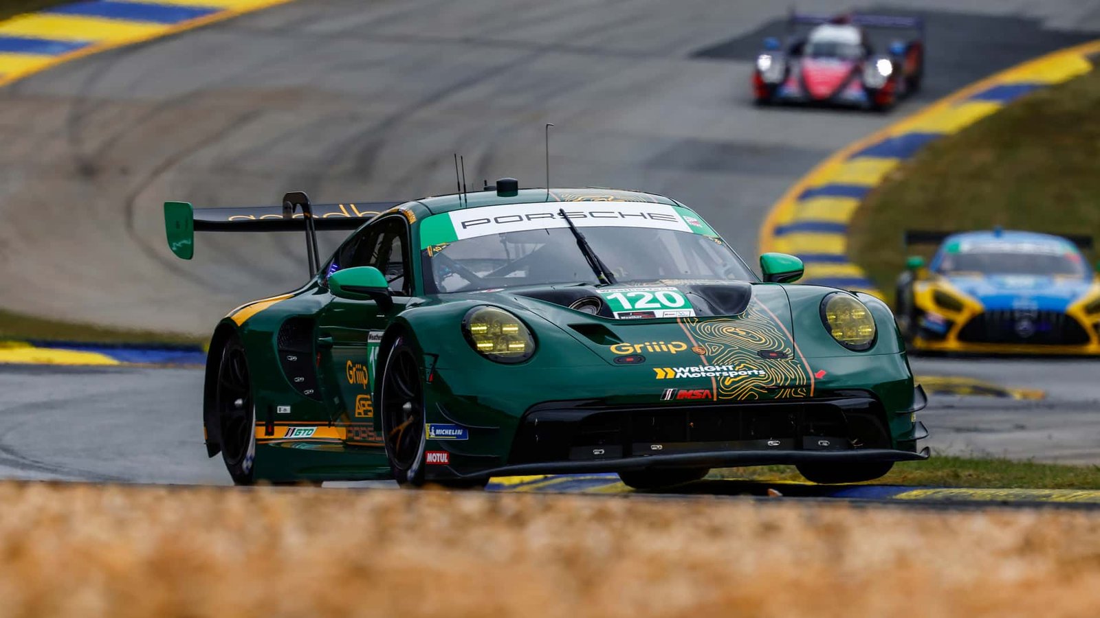 A high-performance sports car taking a tight corner on a track with precision, showing its excellent handling.