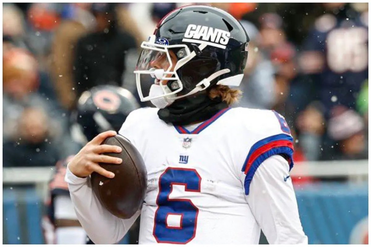 Jaxson Dart under pressure, eyes scanning the field during a crucial moment in a college game.