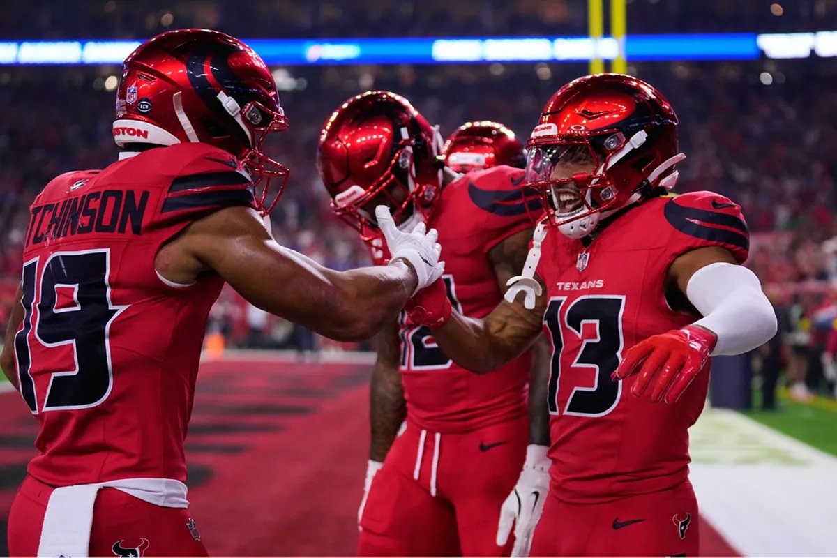 A screenshot from social media showing Erika Kirk at the Bills-Texans game, with circles and arrows highlighting alleged suspicious activity.