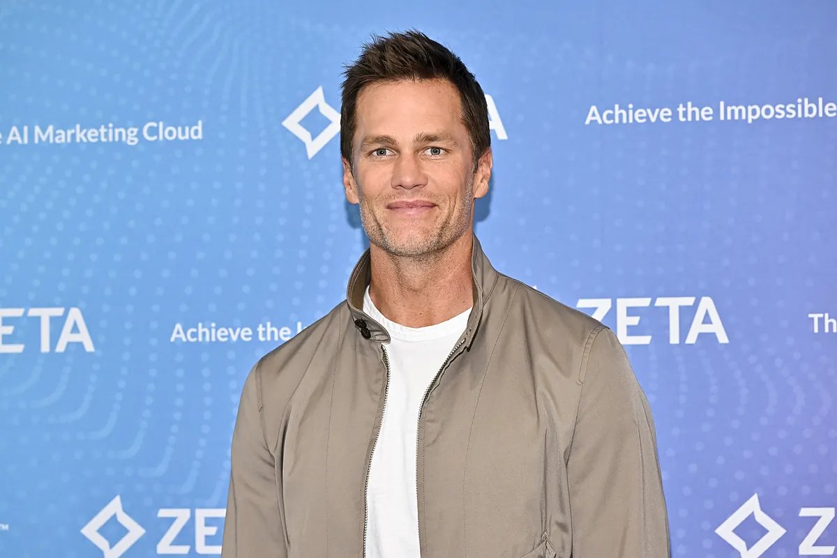 Tom Brady with his cloned dog Junie, highlighting the investment in pet cloning and its ethical implications