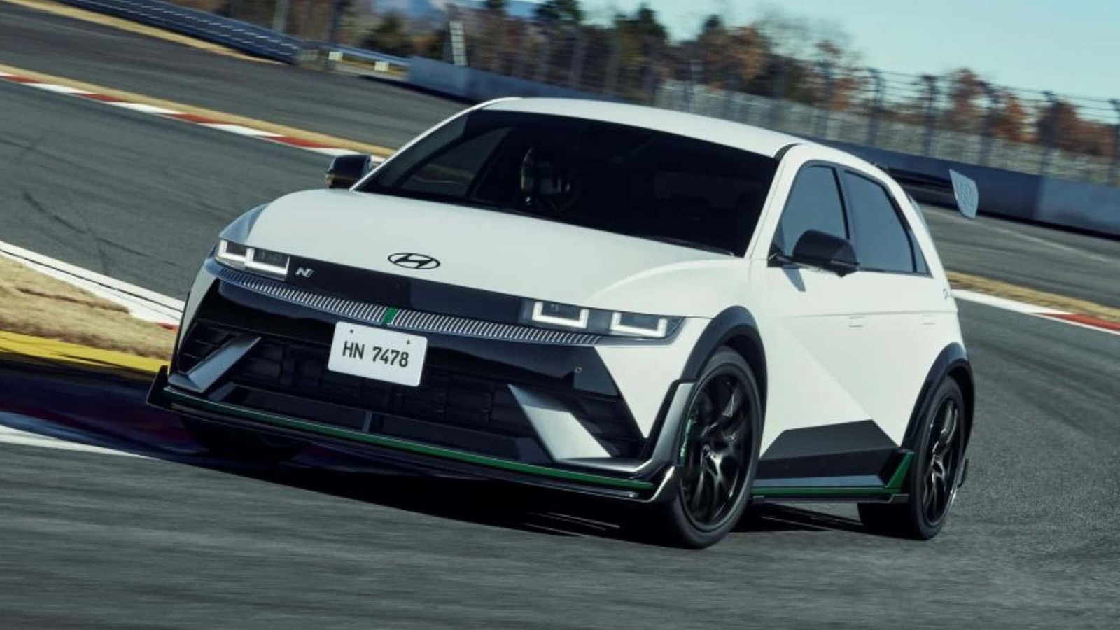 A diverse team of developers collaborating intensely around a large screen displaying lines of code. The room is filled with monitors and whiteboards covered in notes, reflecting a collaborative and focused work environment.