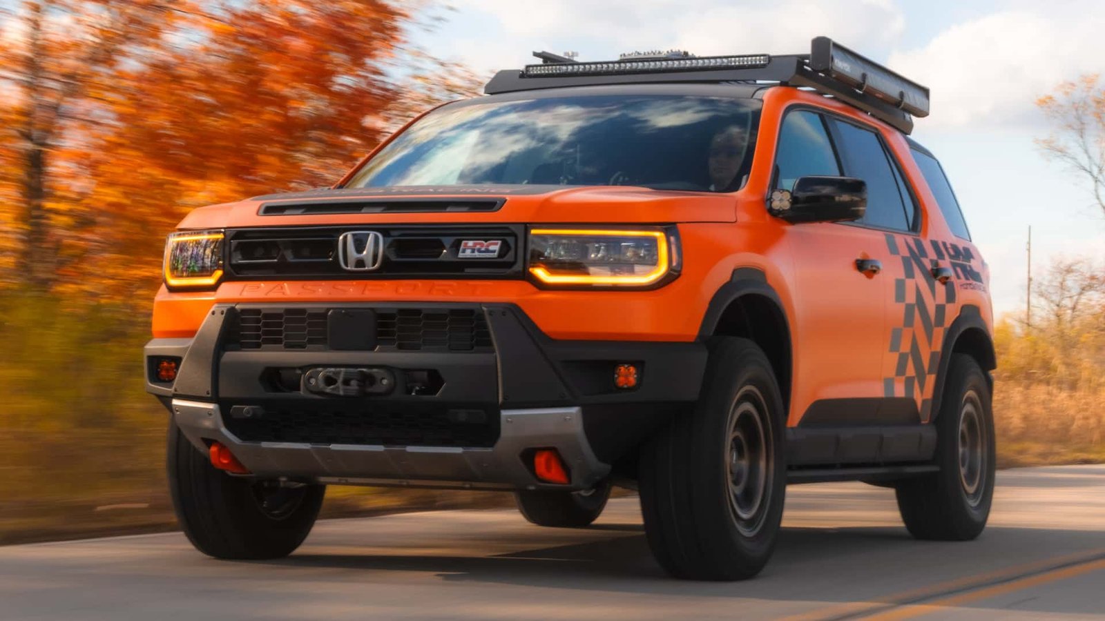 The front view of the upgraded Honda Passport Concept, showcasing its aggressive grille, slim LED headlights, and rugged front bumper with integrated skid plate.