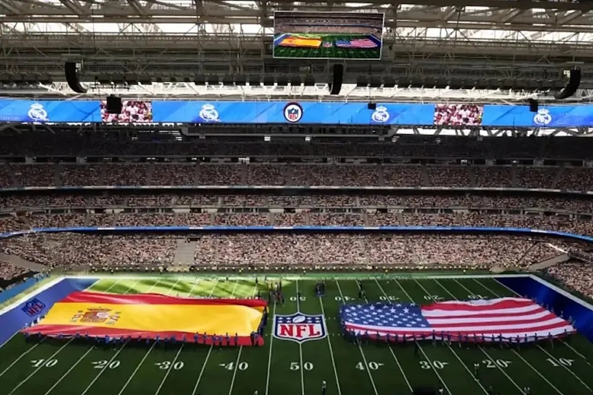A packed Santiago Bernabeu stadium during a Real Madrid match, hinting at the excitement anticipated for the upcoming NFL game.