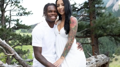 Travis Hunter's wife, Leanna Lenee, happily plays with their baby while the Jaguars suffer another defeat