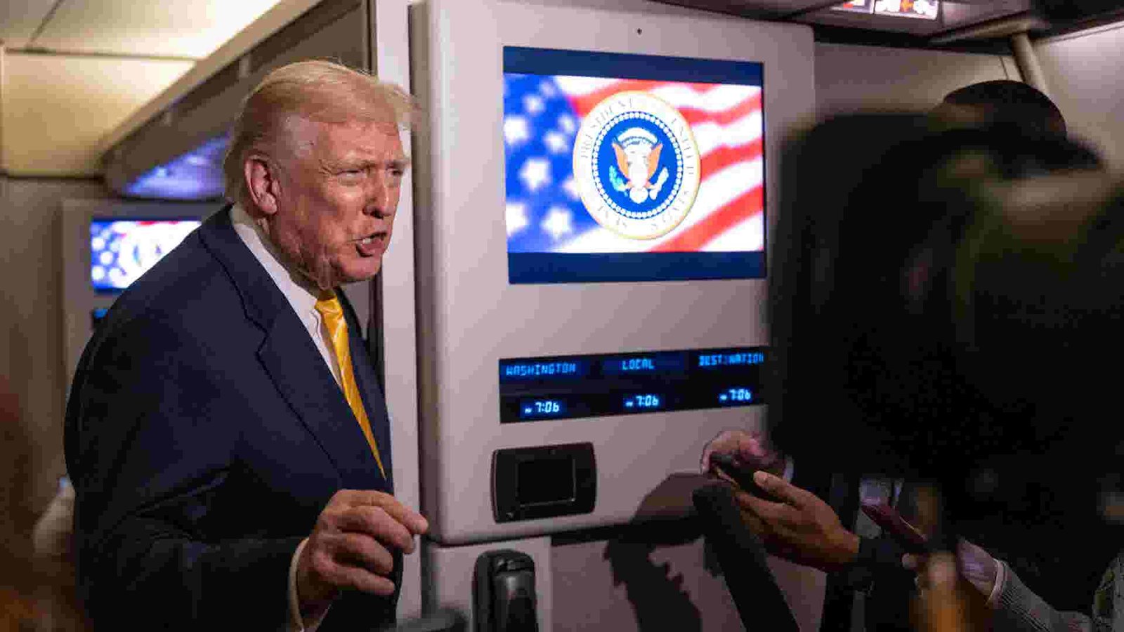 Donald Trump addressing a crowd, with a backdrop suggesting a political rally, embodying his call for the release of the Epstein files.