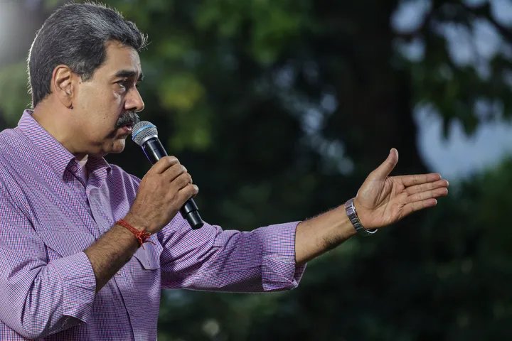 A close-up of Nicolas Maduro speaking at a podium.
