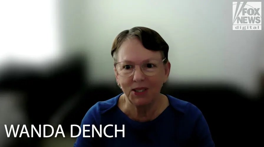 Wanda and Jamal posing for a photo at a Thanksgiving celebration.