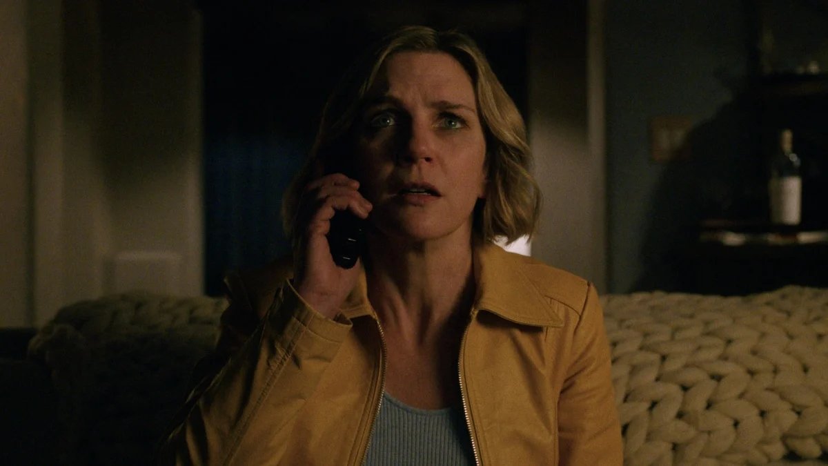 A phone screen displaying the Pluribus phone number and a mysterious message, hinting at interactive storytelling.