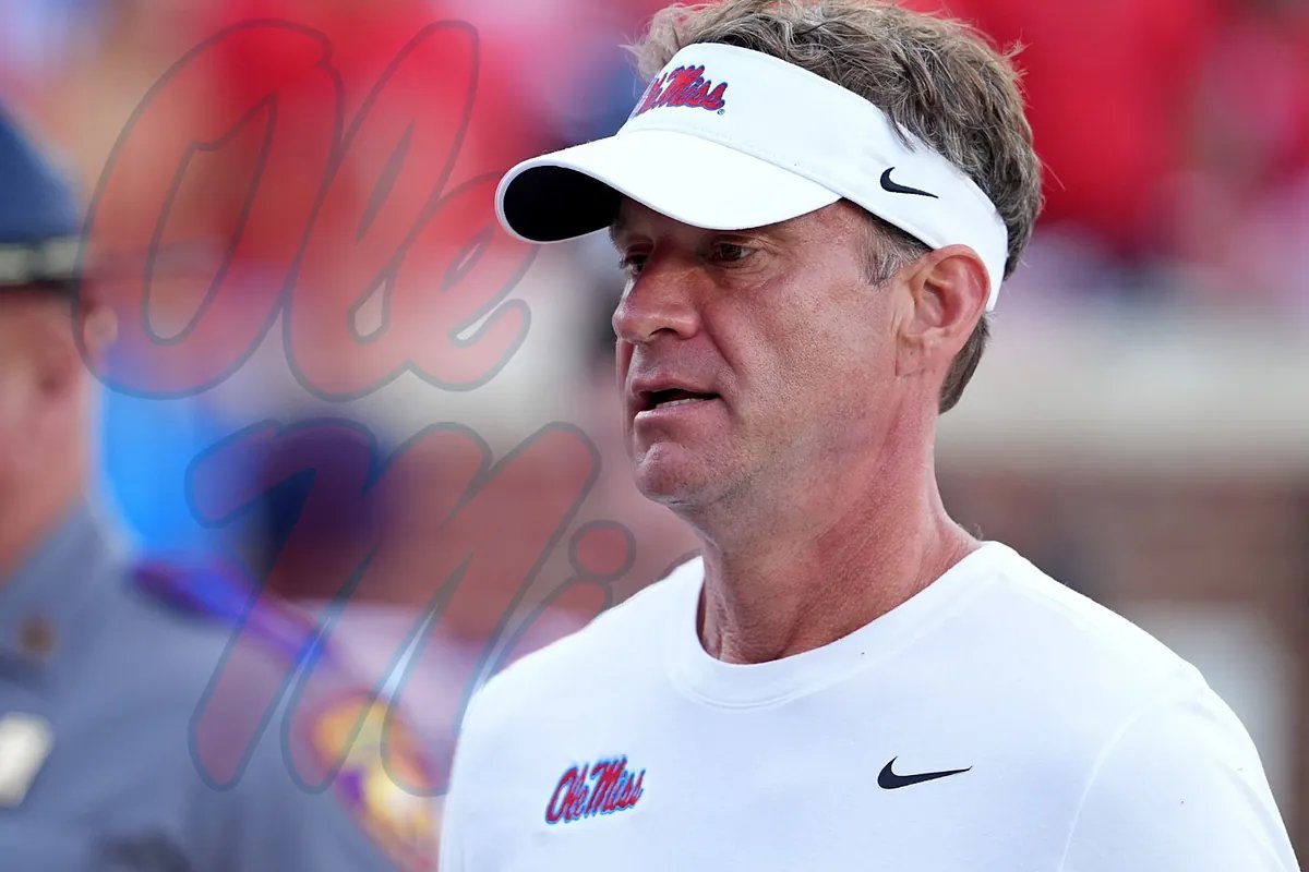 Lane Kiffin coaches Ole Miss on the field, looking intently at the game.