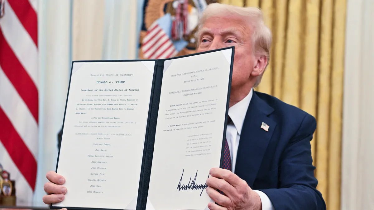 A somber image depicting a large group of people, symbolizing the 'huge group of Americans' potentially under consideration for a pardon by Donald Trump, with an overlay suggesting a moment of reflection or decision.