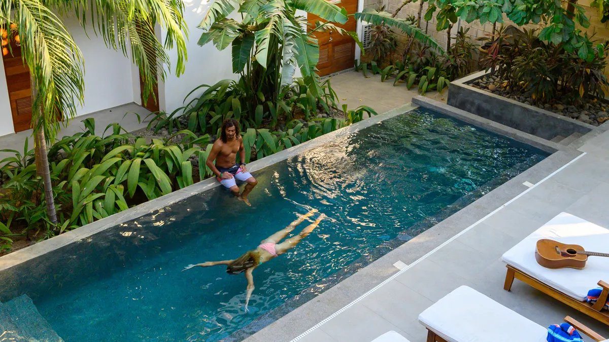 A police officer patrolling a tourist area, illustrating increased law enforcement presence.