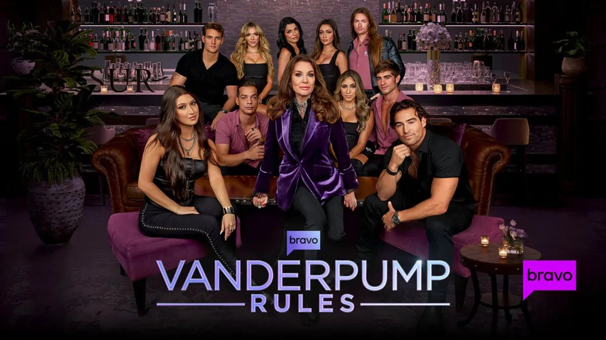 The cast of Vanderpump Rules Season 12 gathers for a group photo, looking both glamorous and apprehensive.