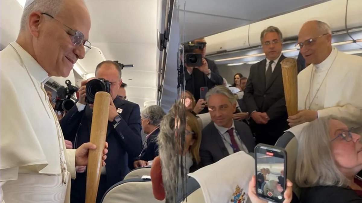 Passengers reacting to Pope Leo XIV's attire on the airplane.